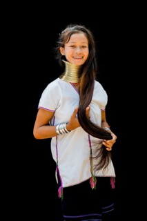 Young Kayan hill tribe woman doing her hair