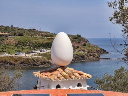 Salvador Dali sculpture of an egg on top of a dovecote
