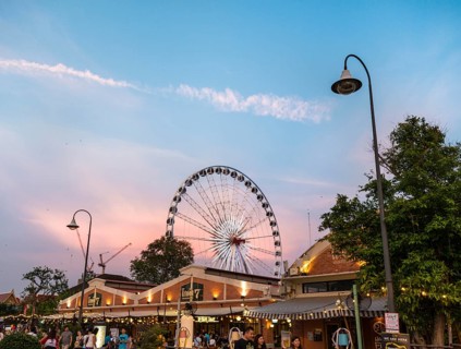 Asiatique Riverfront promenade with Ferris wheel at sunset