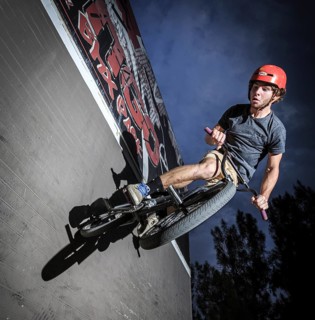 Teenager with BMX bike at skate park