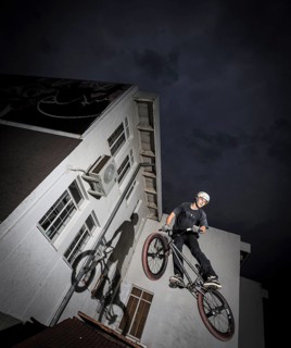 Teenager with BMX bike at skate park