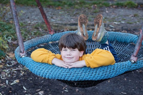 Boy in a swing nest