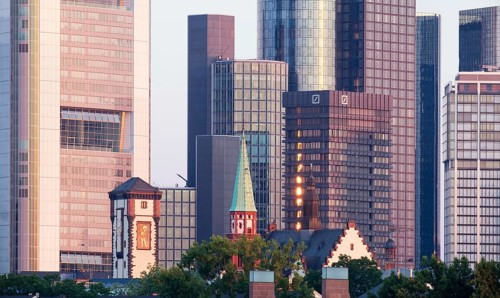 Langer Franz and Old Nikolai Church in front of skyscrapers in the financial district in the morning light