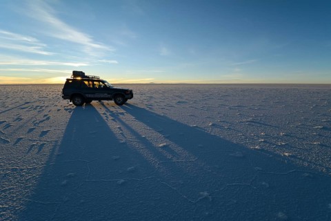 SUV shadow on salt flat