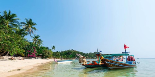 Longtail boats on the sandy beach