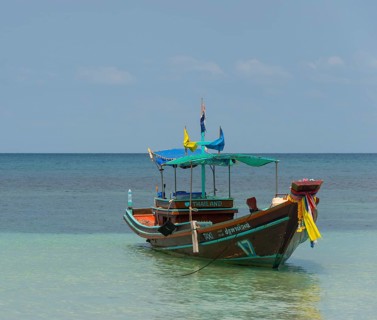 Longtail boat in the turquoise sea