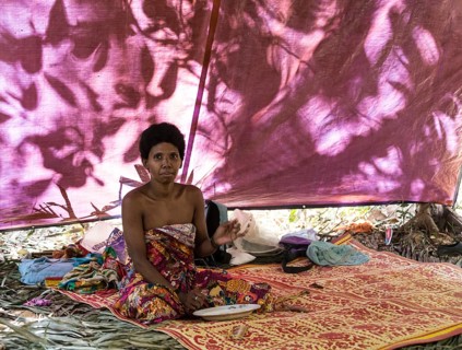 Orang Asil woman sitting in a tent in the jungle