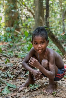 Little boy of the Orang Asil tribe grinning