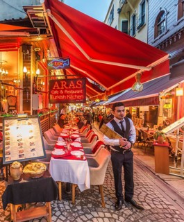 Waiter holding a menu