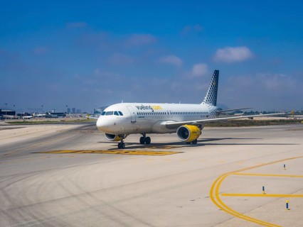 Vueling airliner rolling on the apron of the airport