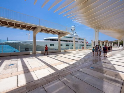 Promenade at the port with a yacht