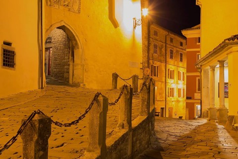 Alley with archway at night