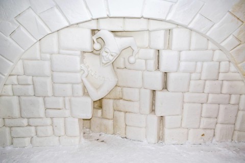 Wall relief of a jester in the ice hotel