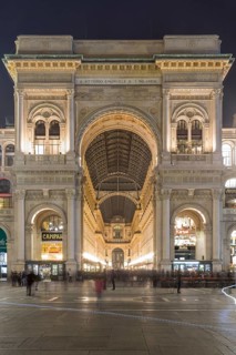 Arch at the entrance to the Galleria Vittorio Emanuele II at night