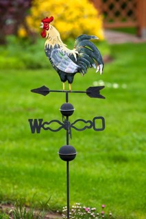 Weathercock made of sheet metal in a garden