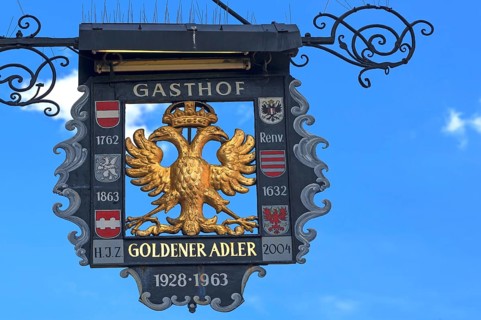 Gasthof Goldener Adler signboard and blue sky