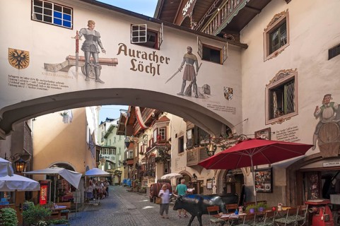 View into an alley of the the historic centre with a restaurant