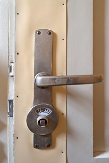 Toilet door lock