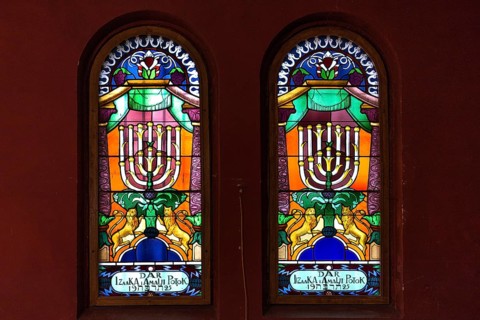 Coloured stained glass windows with seven-armed chandelier