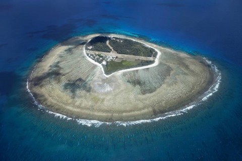 Fringing reef around small island with runway