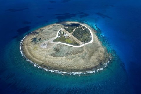 Fringing reef around small island with runway