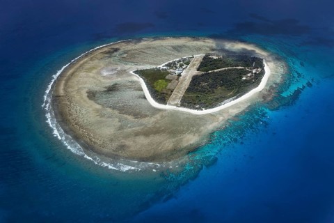 Fringing reef around small island with runway