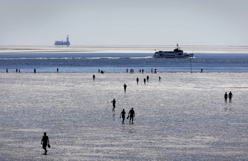 Strollers walking at low tide on the foreshore