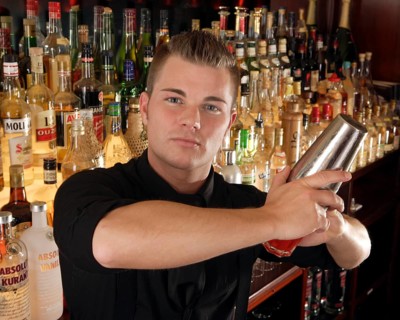 Barman mixing cocktail in a cocktail bar