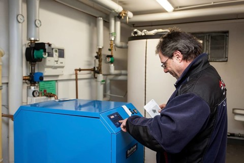 Caretaker checking heating system