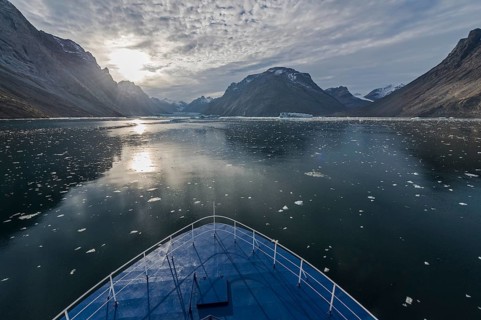 Expedition ship sailing through ice floes