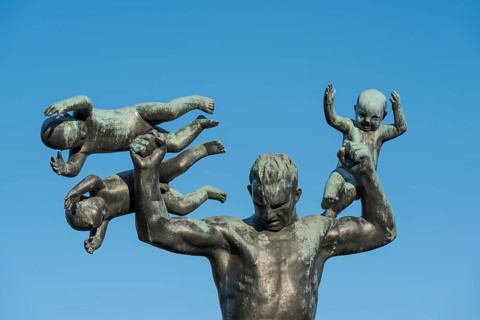 Man with three small children