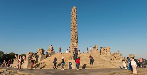 Visitors between granite sculptures