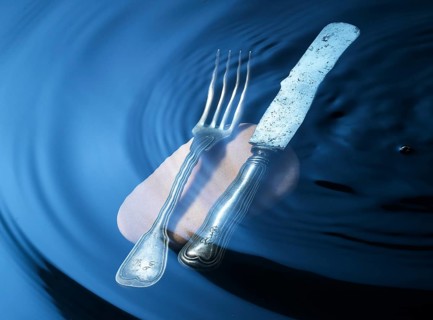 Cutlery on a stone under water