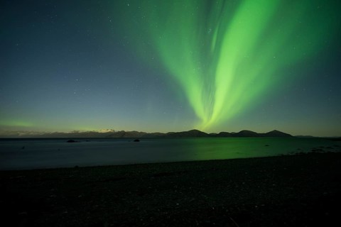 Aurora borealis and moonlight over Prince William Sound