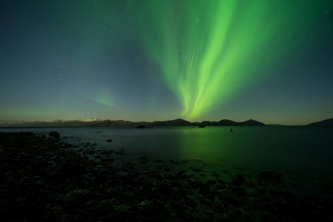 Aurora borealis and moonlight over Prince William Sound