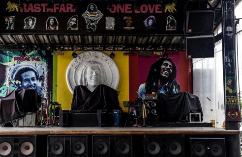 Empty stage for musicians and photos of Bob Marley