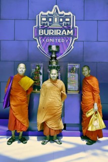 Monks posing in front of the Master Cup of Buriram United