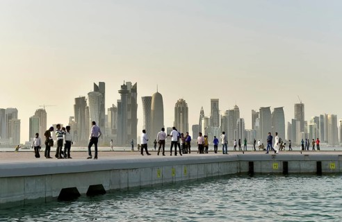 Passers-by and skyscraper skyline