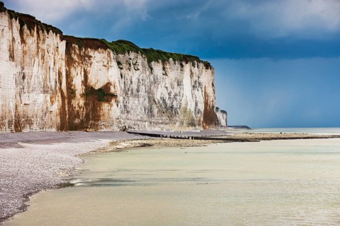 Storm clouds over chalk cliffs on the coast near Saint-Valery-en-Caux