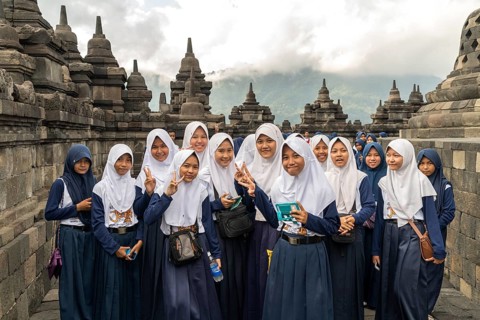 Muslim schoolgirl in uniform with headscarf