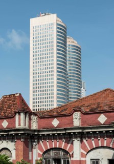 Towers of World Trade Center and abandoned colonial house