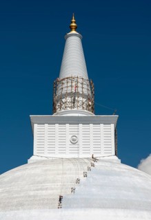 A group of climbers paint Ruwanwelisaya or Ruwanweli Maha Seya Stupa