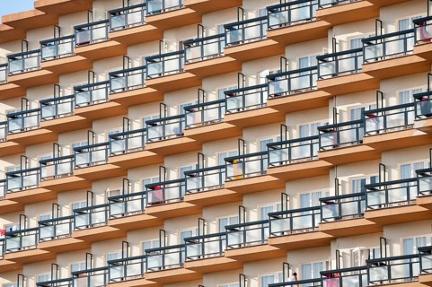 Rows of balconies on the facade of a large hotel complex in Torremolinos