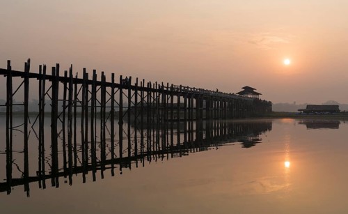 Sunrise over the U Bein Bridge crossing the Taungthaman Lake