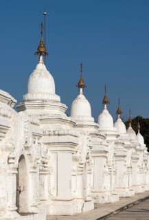 Row of whitewashed stone-inscription caves at Kuthodaw Pagoda