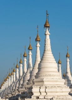 Row of white stupas of Sandamuni or Sanda Muni Pagoda