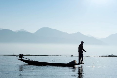 Intha fisherman with boat on Inle Lake