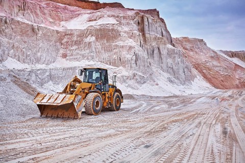 Shovel excavator in kaolin pit