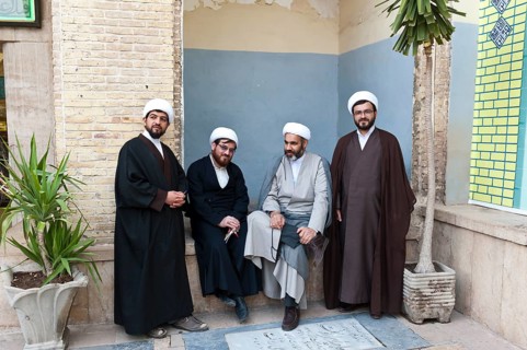 Four mullahs with turbans and long robes