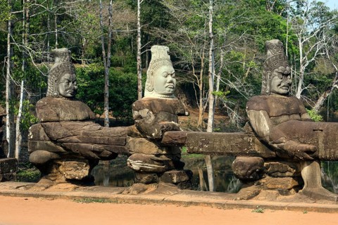 Asura sandstone statues in front of the South Gate of Angkor Thom